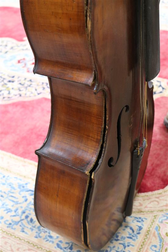 A full sized cello bearing label Arthur Richardson ... and two bows (one silver mounted), the other signed Wilhelm ... uhl